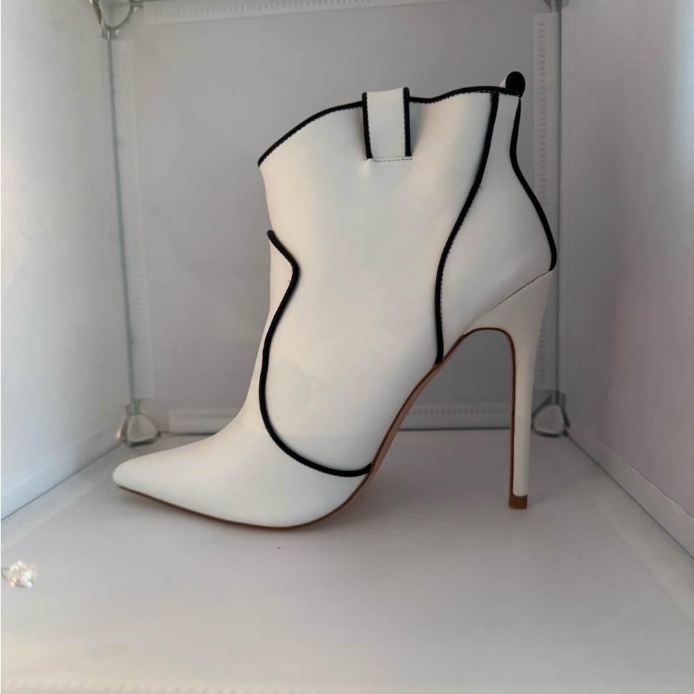 Cute white boot heals with black trim